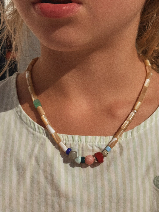 the collector necklace in sand