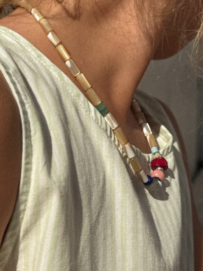 the collector necklace in sand