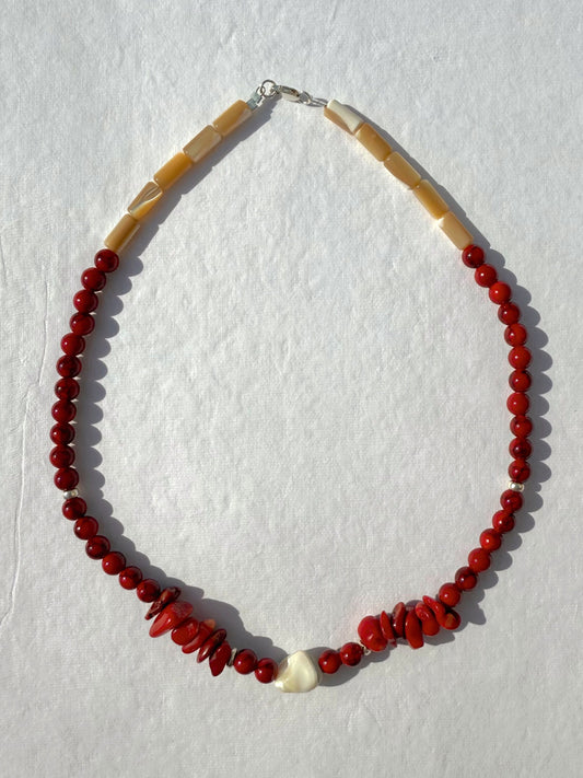 necklace made of red coral and mother of pearl with shell detail and sterling closures. 